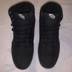 High-top sneakers by Vans